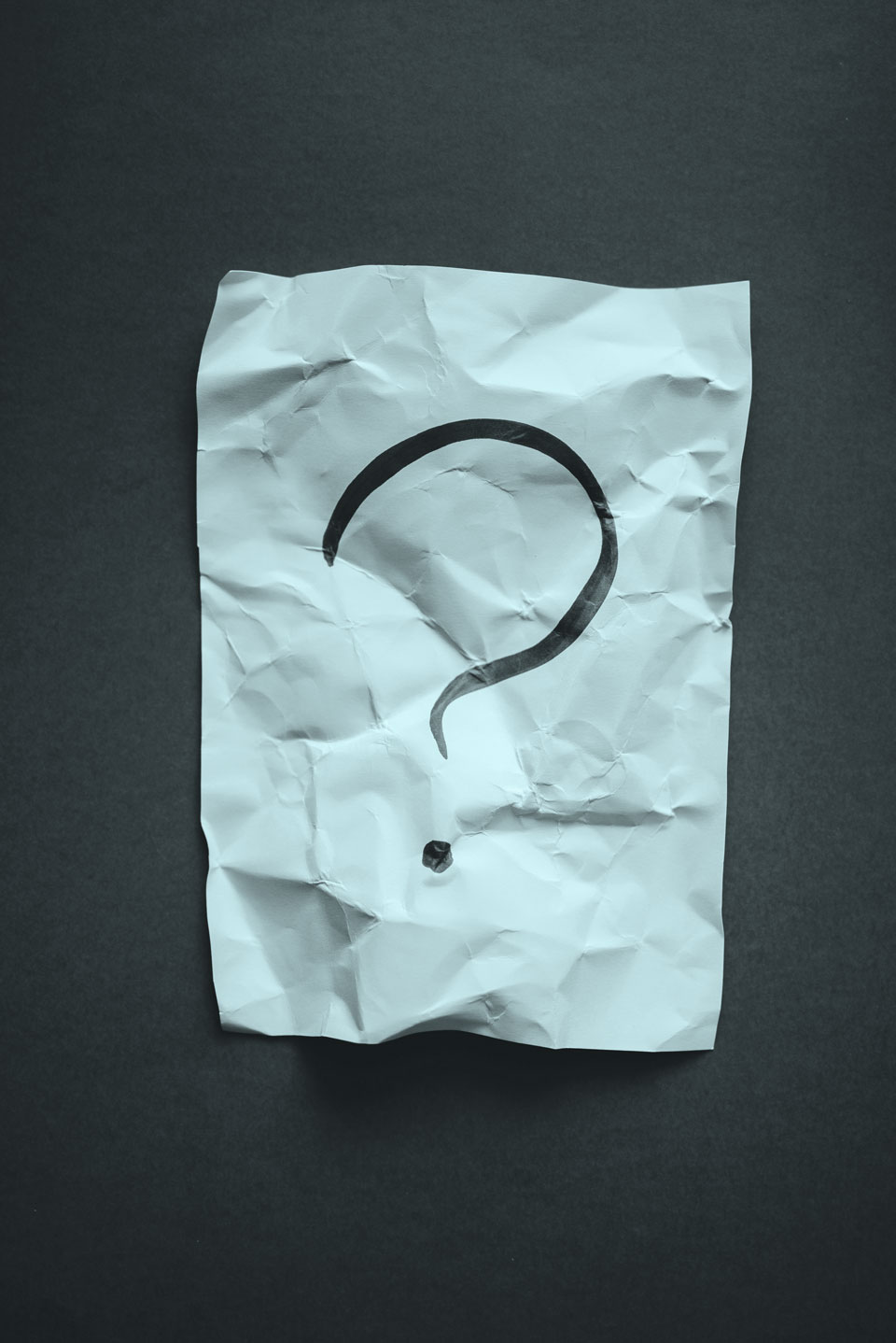 question mark on crumpled paper